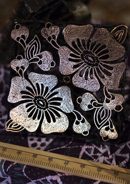 A copper block stamp to apply hot wax for batik, Penang island, George Town, Malaysia