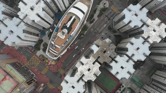 Hong Kong landmarks - drone shot of massive cruise ship functioning as commercial shopping mall and restaurant in Whampoa district
