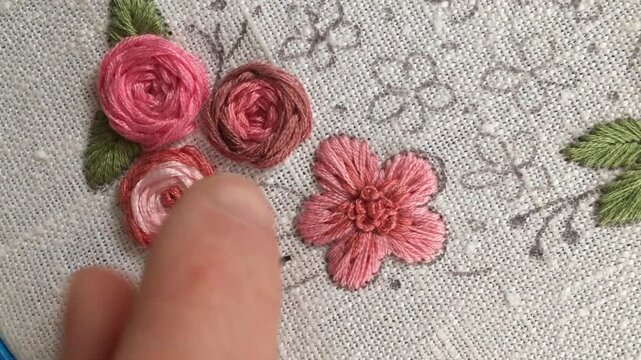 Fishbone stitch leaf embroidery tutorial. Close-up hand stitching realistic leaf shape with angled threads on fabric. Step-by-step botanical embroidery technique for beginners, Part 1