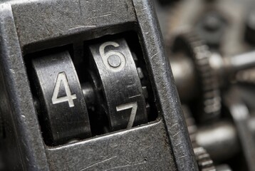Vintage mechanical counter close up displaying numeric sequence, analog precision concept