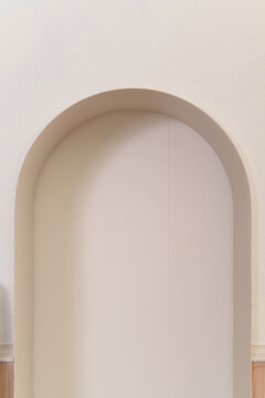 Minimal archway wall interior pastel arch niche soft beige plaster modern home design contemporary architecture detail calm neutral background subtle texture surface light wooden baseboard