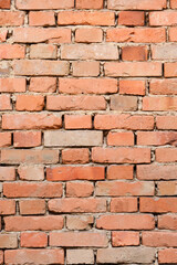 Obraz premium Detailed front view of a weathered antique red brick wall with visible mortar and rustic clay bricks in various shades of orange and brown.