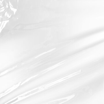 Wrinkled clear plastic wrap texture with white background highlight for product packaging design overlay and glossy cellophane material texture for creative visual effects compositions