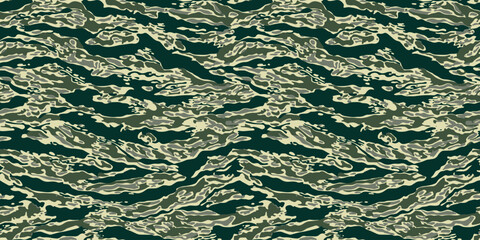 Hunting camouflage. Tiger stripe pattern. Tiger stripe camouflage pattern. Camouflage seamless pattern. Forest real tree camouflage design. © Rashid