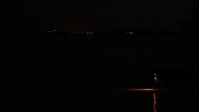 Fisherman with Spotlight in Water at Night in Batam, Riau Islands 4K