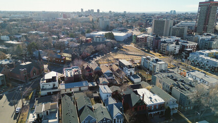 Congress Park urban houses block stretch toward institutional buildings along 8th Ave. Even...