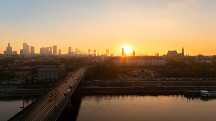 Fototapeta premium An aerial view of the Vistula River overlooking Warsaw's Old Town in Poland during the autumn sunset