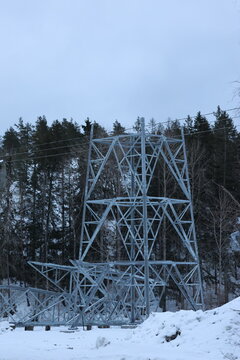 Close Up of how to build a Power Line Pole with blue sky and snow on ground. Perfect illustration to energy related items