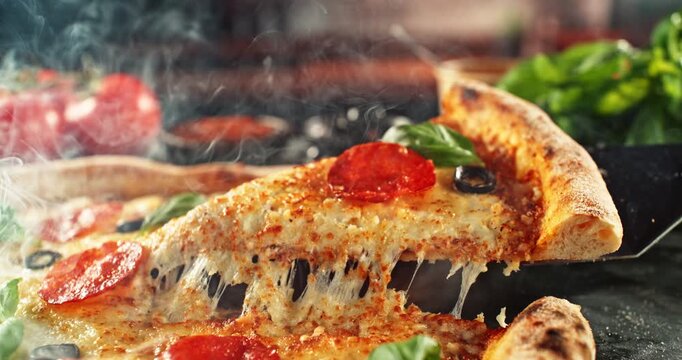 Super slow motion footage (1000 fps) of a pizza slice being lifted with perfectly melted, stretchy cheese. Rich textures of crust, salami, tomato and fresh basil in cinematic light.