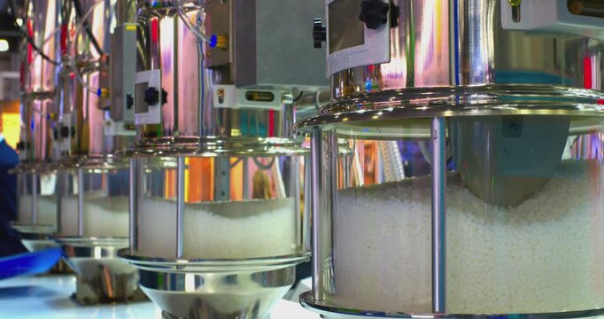 A state-of-the-art industrial system automatically blends plastic pellets into homogenous mixtures using advanced robotics and computerized controls. This video demonstrates high-tech solutions for ma
