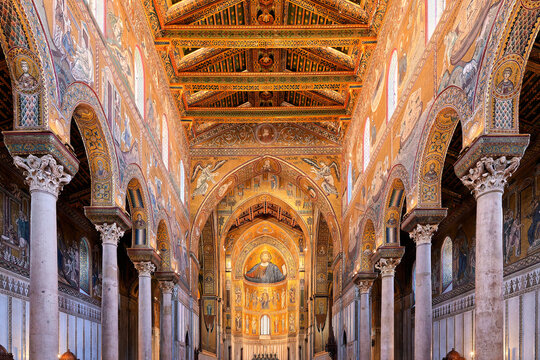 A view through the monumental nave of Monreale Cathedral towards the enthroned Christ Pantocrator
