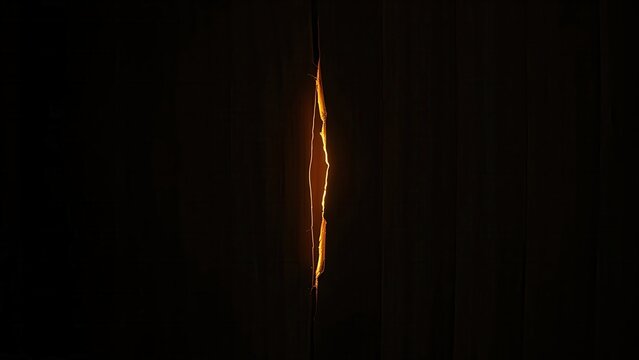 A thin golden light from a crack in dark wood, suggesting hidden space. 