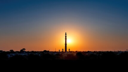 Majestic Sunset Over Historical Minaret Silhouette with Vibrant Sky and Cityscape in Background, Capturing the Essence of Cultural Heritage at Dusk