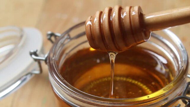 honey dripping from a jar