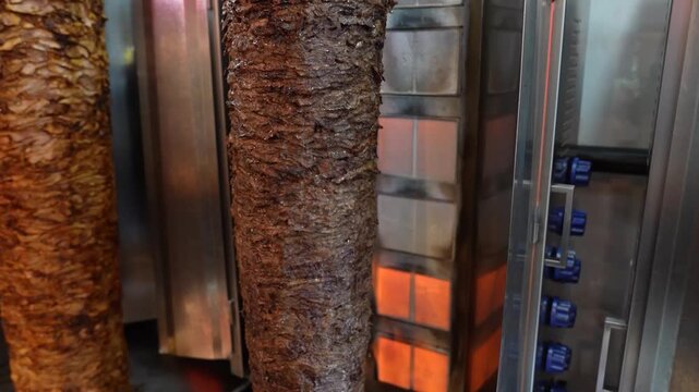 Shawarma Meat Rotating on Vertical Grill &ndash; Traditional Middle Eastern Food