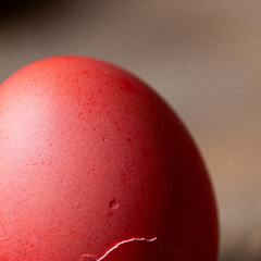 Extreme macro of naturally dyed red Easter eggshell texture