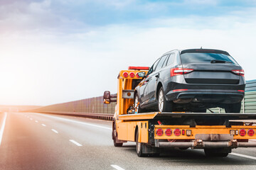 Roadside help service transporting disabled vehicle © AlexGo