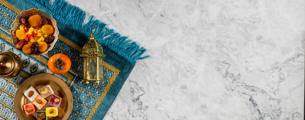 Iftar fast-breaking evening meal of Muslims in Ramadan at the time of adhan. Arabic lantern for Muslim holy month Ramazan Kareem. Decorative Holiday lamp © TSViPhoto