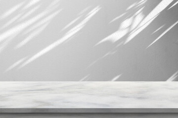 Obraz premium White marble stone podium on grey wall background with natural leaf shadows for product presentation mockup