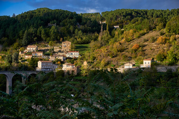 A scenic panoramic photograph of the town of Privas, the capital of the Ard&egrave;che department in Southern France. The image showcases the historic town center with its traditional multi-story stone build