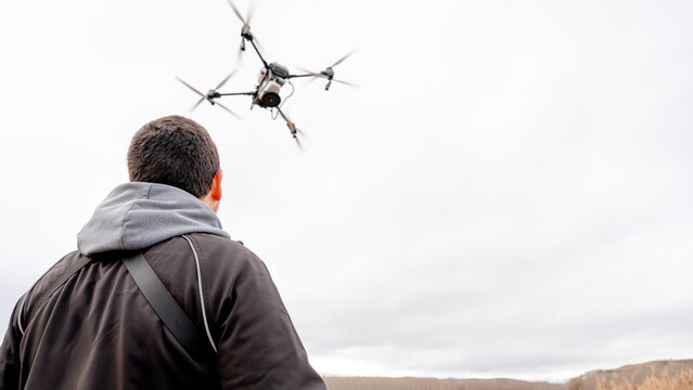 Farmer operating advanced agricultural drone