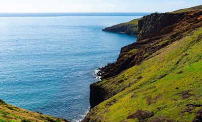 Hikers on high cliffs of Madeira Portugal.