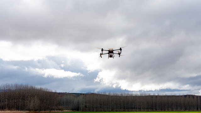 Agricultural drone flying over a field for sustainable farming