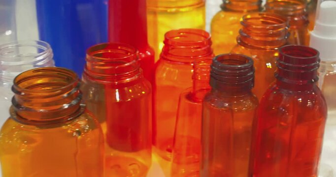 This video features examples of plastic products made using various manufacturing processes. Close-up.