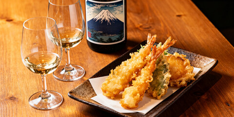 Tempura and two wine glasses of sake