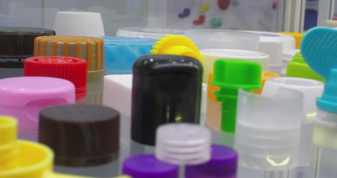 This video shows display samples of multicolored plastic product production. Various products are shown. The video includes close-ups of the finished products.