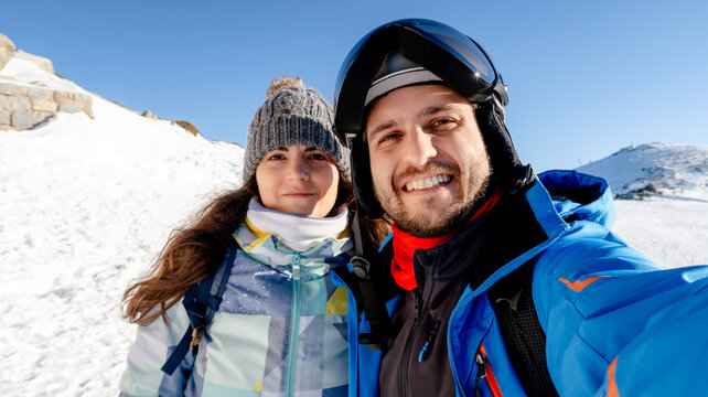 Couple enjoying skiing at Puerto de Navacerrada, Madrid