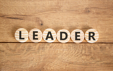 Leadership and leader symbol. Concept word Leader on beautiful wooden circles. Beautiful wooden background. Business leader and leadership concept. Copy space.