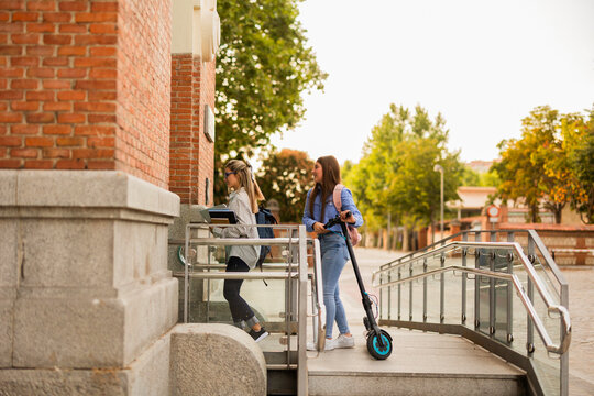 Mother and daughter heading to school together