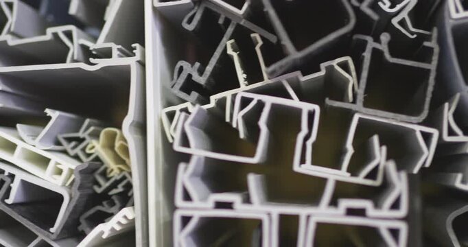 Explore the intricate details of diverse plastic and rubber profiles with this macro video. Perfectly capturing their unique forms and hues, this footage is invaluable for understanding the raw materi