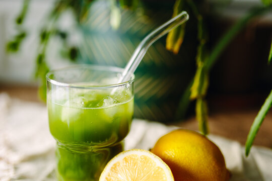 Refreshing iced matcha drink with lemon slices