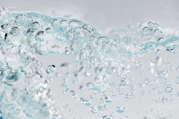 Closeup Transparent blue clear water surface texture with ripples. Abstract​ of​ surface​ blue​ splashes and bubbles​ water waves  reflected​ with​ sunlight​