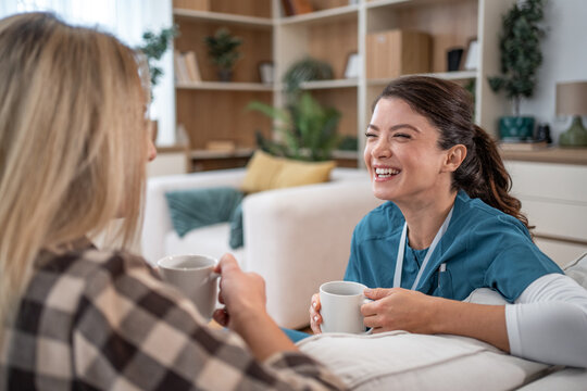 Caregiver and patient bonding over shared coffee break and laughter