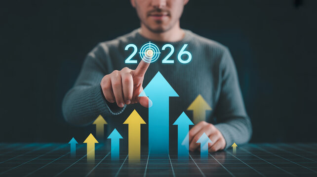 Man interacting with holographic projections of growth arrows and the year 2026.