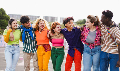 Group of young diverse people having fun outdoor laughing together - Diversity, LGBT and generation z concept - Main focus on center faces