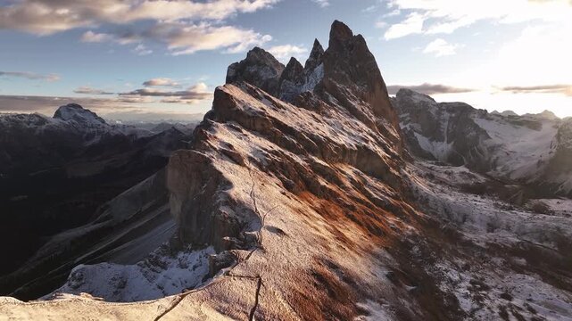 Bright sunlight is over horizon. Seceda mountain, aerial view of majestic nature, beautiful touristic place.