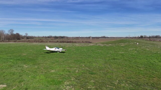 4K Drone Footage of Two Seat Ultralight Aircraft Preparing for Takeoff at Airfield