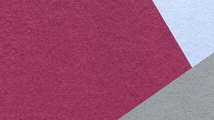 Fototapeta premium Dark purple textured paper background with light blue gray triangular corners and copy space. Template for presentation