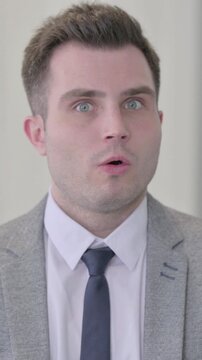 Portrait of Young Businessman shocked by Failure