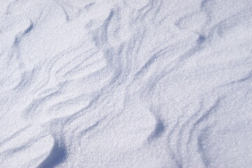 Fototapeta premium Fresh Snow Surface Pattern in Natural Sunlight