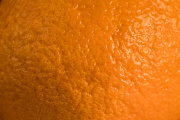 Macro close-up of Dekopon (Shiranui) orange peel showing detailed natural citrus texture and vibrant surface. Ideal for food backgrounds, citrus concepts, and fresh fruit visuals.