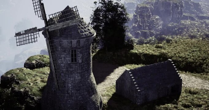 A windmill, crafted from stone, towers over a lush green area near rocky cliffs. A quaint, rustic building rests beside it, creating a serene countryside atmosphere at dawn.