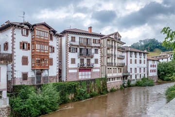 Fototapeta premium Riverside Houses and Baztan River in Elizondo Village, Stone Facades, Navarra