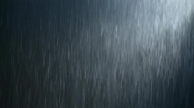 Heavy rain pouring down from the sky, capturing the relentless downpour from a close-up viewpoint