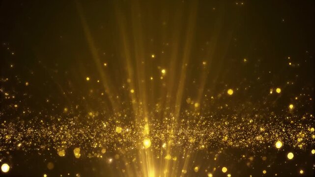 Golden particles exploding outward from a central point, creating a starburst effect with shiny, glowing dots and rays.