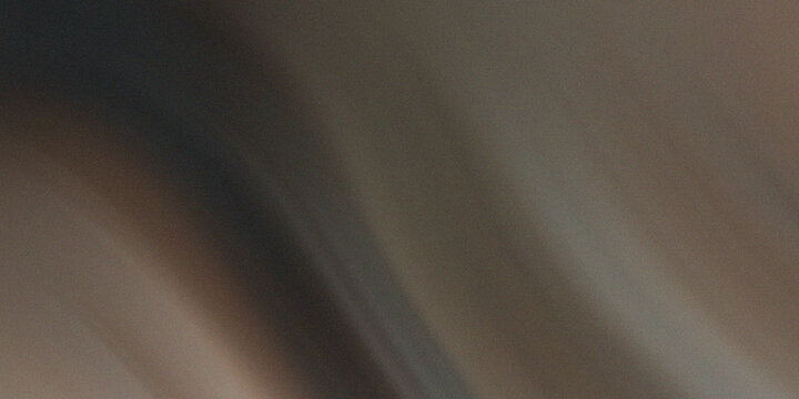 Dark brown abstract texture with deep shadows and subtle grain